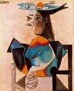 Пабло Пикассо - Сидящая женщина в шляпе-рыбе 1942